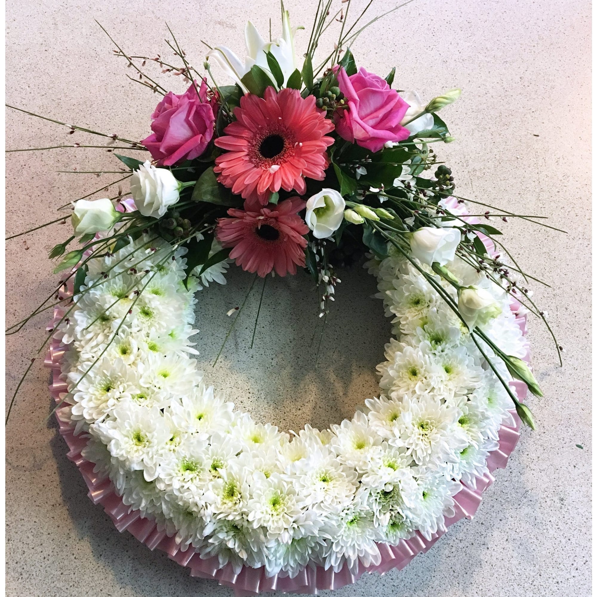 white and pink massed funeral wreath tipperary